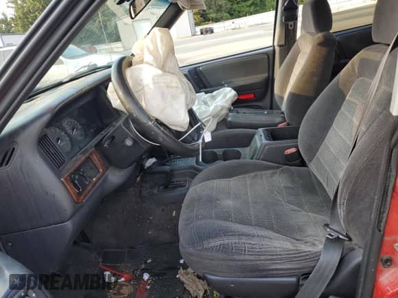 1996 Jeep Grand Cherokee с VIN 1J4EZ58Y5TC142263, выставлен на аукционе Copart как лот 70532894 с пробегом Не указан миль и Списание • Salvage title. История ставок и продаж доступна на DreamBid. Изображение 7.