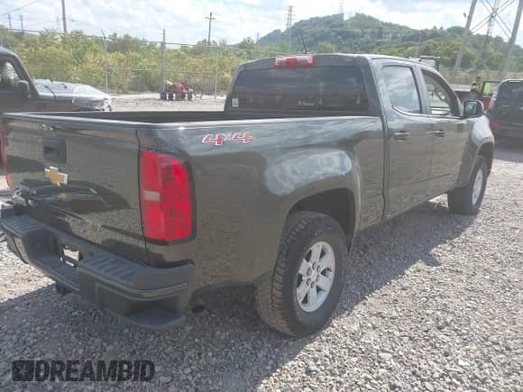 2018 Chevrolet Colorado 4WD Work Truck z VIN 1GCGTBEN8J1141920, wystawiony jako IAAI lot #43080248 z przebiegiem 86 682 mil mil oraz . Historia ofert i sprzedaży dostępna na DreamBid. Obrazek 4.