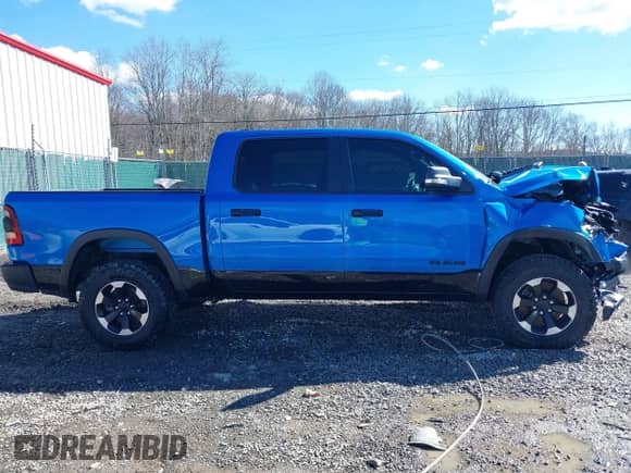 2022 Ram 1500 Rebel z VIN 1C6SRFLT0NN177124, wystawiony jako IAAI lot #41575076 z przebiegiem 40 065 mil mil oraz . Historia ofert i sprzedaży dostępna na DreamBid. Obrazek 13.