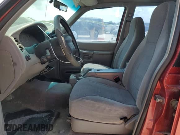 1999 Ford Explorer XL with VIN 1FMZU32X0XZB20762, listed as a Copart auction lot 73648134 with 142,158 mi miles and Salvage title. Bid and sale history available at DreamBid. Image 7.