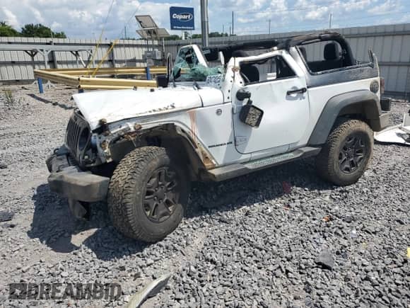 2015 Jeep Wrangler Willys Wheeler with VIN 1C4AJWAG7FL704493, listed as a Copart auction lot 63474255 with Not provided miles and Salvage title. Bid and sale history available at DreamBid. Image 1.