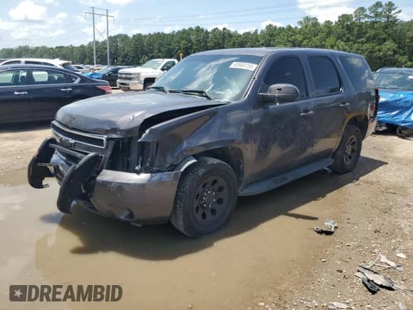 2011 Chevrolet Tahoe Commercial z VIN 1GNLC2E0XBR136988, wystawiony jako Copart lot #60869755 z przebiegiem 190 507 mil mil oraz Szkoda całkowita • Salvage title. Historia ofert i sprzedaży dostępna na DreamBid. Obrazek 1.