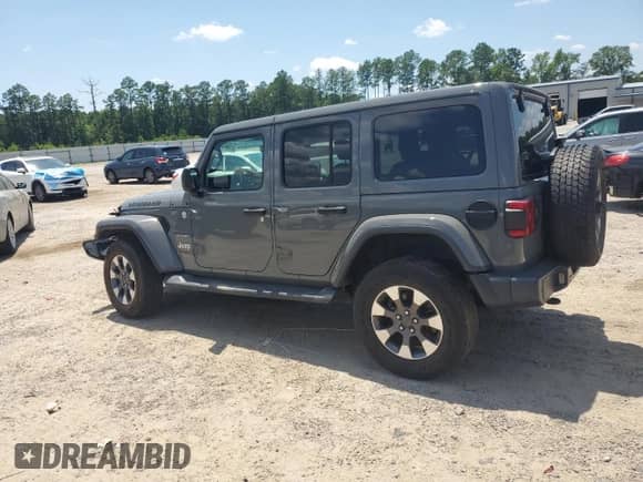 2021 Jeep Wrangler Unlimited Sahara with VIN 1C4HJXEN6MW590284, listed as a Copart auction lot 61804035 with 74,789 mi miles and Salvage title. Bid and sale history available at DreamBid. Image 2.