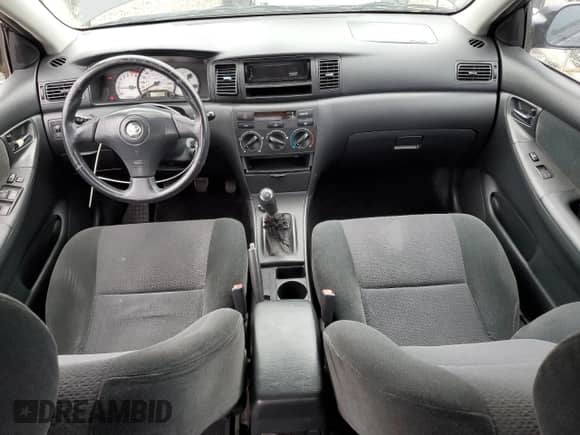 2003 Toyota Corolla CE z VIN 1NXBR32E43Z035870, wystawiony jako Copart lot #86801905 z przebiegiem 162 701 mil mil oraz Szkoda całkowita • Salvage title. Historia ofert i sprzedaży dostępna na DreamBid. Obrazek 8.