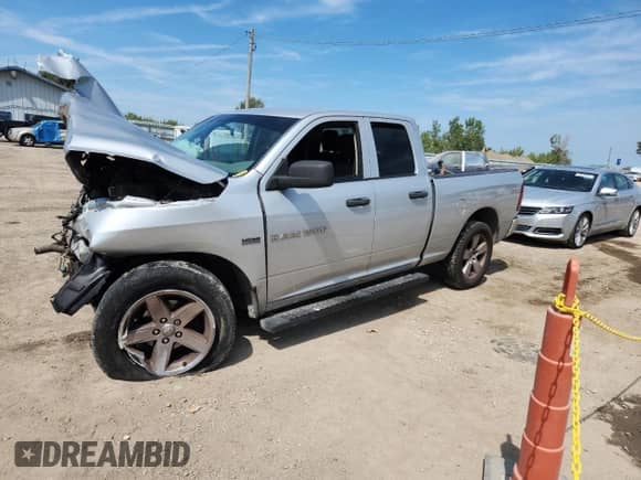 2012 Ram 1500 Express с VIN 1C6RD6FT0CS322959, выставлен на аукционе Copart как лот 70642285 с пробегом Не указан миль и Списание • Salvage title. История ставок и продаж доступна на DreamBid. Изображение 1.