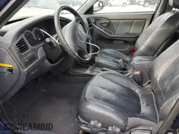 2003 Hyundai Elantra GT z VIN KMHDN55D03U078377, wystawiony jako Copart lot #51100395 z przebiegiem 192 766 mil mil oraz Szkoda całkowita • Salvage title. Historia ofert i sprzedaży dostępna na DreamBid. Obrazek 7.