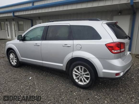 2014 Dodge Journey SXT with VIN 3C4PDCBB8ET180650, listed as a Copart auction lot 85146925 with 181,951 mi miles and Salvage title. Bid and sale history available at DreamBid. Image 2.