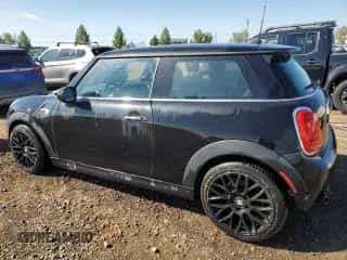 2014 MINI Hardtop with VIN WMWXM5C51ET731031, listed as a Copart auction lot 63807985 with 142,700 mi miles and Clean title. Bid and sale history available at DreamBid. Image 2.