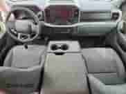 2023 Ford F-150 Lariat with VIN 1FTFW1E89PFA91516, listed as a Copart auction lot 61666315 with 65,711 mi miles and Salvage title. Bid and sale history available at DreamBid. Image 8.