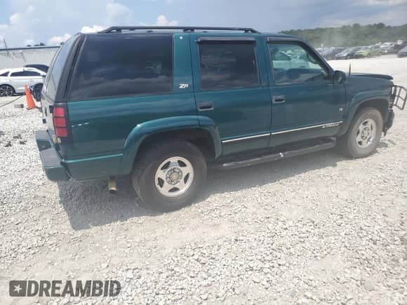 2000 Chevrolet Tahoe Z71 с VIN 1GNEK13R8YR126606, выставлен на аукционе Copart как лот 64043135 с пробегом 284 964 миль миль и Списание • Salvage title. История ставок и продаж доступна на DreamBid. Изображение 3.