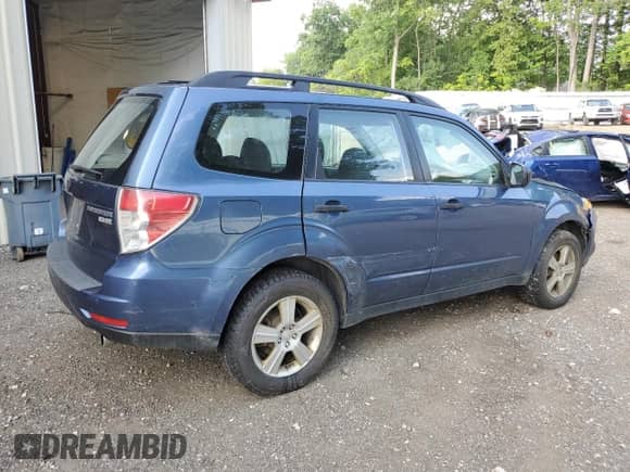 2011 Subaru Forester X z VIN JF2SHABC1BG711507, wystawiony jako Copart lot #64486475 z przebiegiem 173 037 mil mil oraz Szkoda całkowita • Salvage title. Historia ofert i sprzedaży dostępna na DreamBid. Obrazek 3.