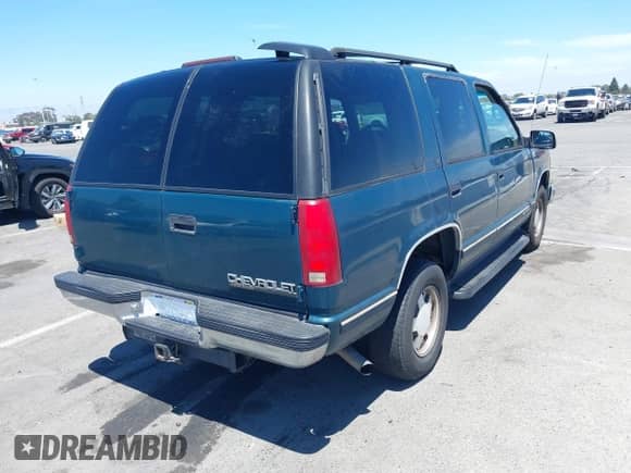 1999 Chevrolet Tahoe z VIN 1GNEC13R9XJ503955, wystawiony jako IAAI lot #42830511 z przebiegiem 185 483 mil mil oraz . Historia ofert i sprzedaży dostępna na DreamBid. Obrazek 4.