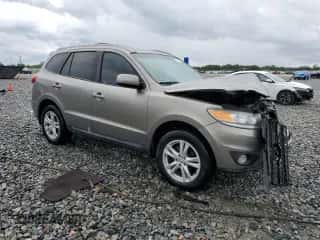 2012 Hyundai Santa Fe SE z VIN 5XYZH4AG2CG144263, wystawiony jako Copart lot #81185525 z przebiegiem 134 304 mil mil oraz Szkoda całkowita • Salvage title. Historia ofert i sprzedaży dostępna na DreamBid. Obrazek 4.