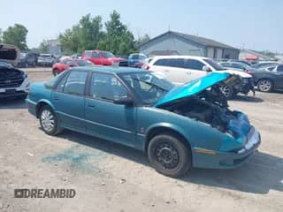 1994 Saturn SL with VIN 1G8ZJ557XRZ136761, listed as a IAAI auction lot 42476500 with 200,187 mi miles and . Bid and sale history available at DreamBid. Image 1.