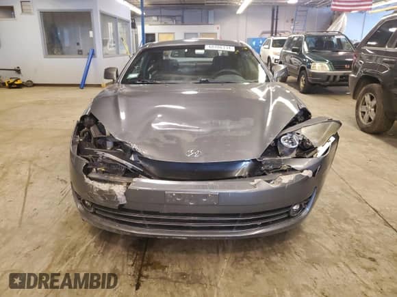 2007 Hyundai Tiburon GS with VIN KMHHM66D17U258112, listed as a Copart auction lot 60286334 with 117,735 mi miles and Salvage title. Bid and sale history available at DreamBid. Image 5.