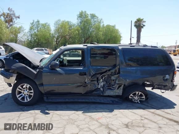 2006 Chevrolet Suburban LS 1WT z VIN 1GNEC16Z06J140083, wystawiony jako IAAI lot #42873925 z przebiegiem 254 683 mil mil oraz . Historia ofert i sprzedaży dostępna na DreamBid. Obrazek 14.