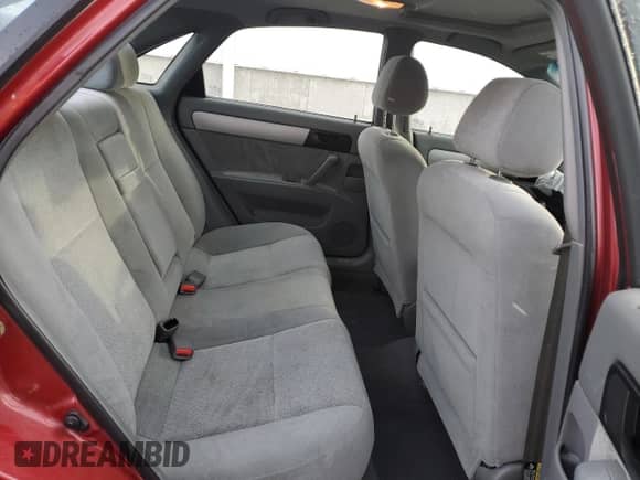 2005 Chevrolet Optra LS с VIN KL1JK59Z25K101251, выставлен на аукционе Copart как лот 87930375 с пробегом 93 894 миль миль и Списание • Salvage title. История ставок и продаж доступна на DreamBid. Изображение 10.