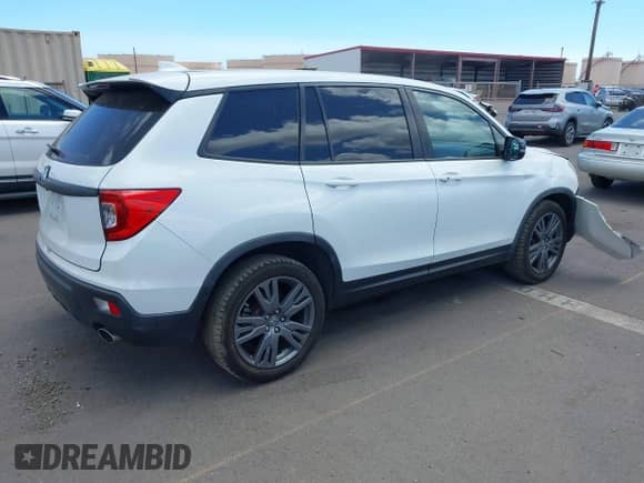 2021 Honda Passport EX-L with VIN 5FNYF7H59MB001083, listed as a IAAI auction lot 42943781 with 56,549 mi miles and . Bid and sale history available at DreamBid. Image 4.