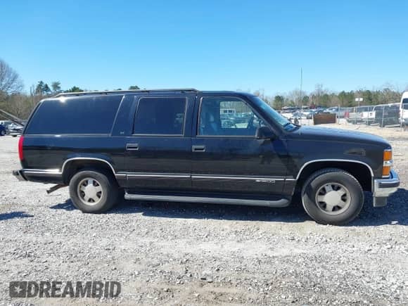1999 Chevrolet Suburban with VIN 3GNEC16R0XG137834, listed as a IAAI auction lot 41853492 with 296,147 mi miles and . Bid and sale history available at DreamBid. Image 13.