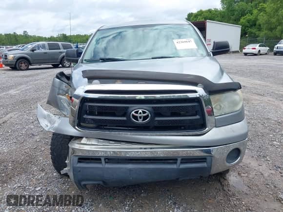 2012 Toyota Tundra z VIN 5TFRU5F14CX027982, wystawiony jako IAAI lot #42369647 z przebiegiem 169 286 mil mil oraz . Historia ofert i sprzedaży dostępna na DreamBid. Obrazek 12.
