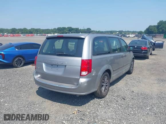 2013 Dodge Grand Caravan SE with VIN 2C4RDGBG9DR799528, listed as a IAAI auction lot 42894435 with 142,036 mi miles and . Bid and sale history available at DreamBid. Image 4.