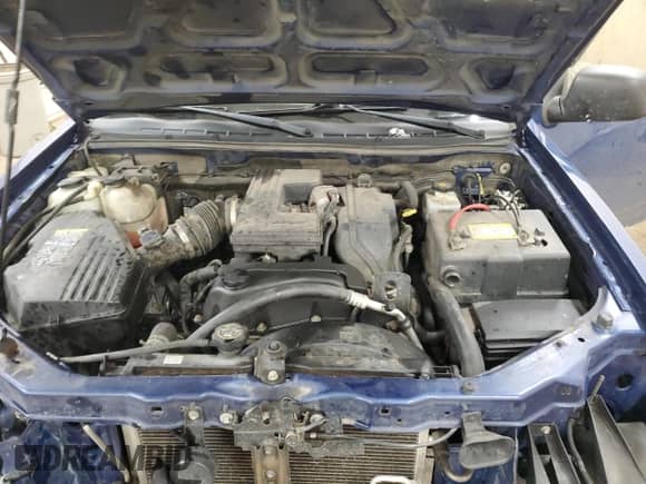 2006 Chevrolet Colorado Work Truck z VIN 1GCDT196468232407, wystawiony jako Copart lot #88733495 z przebiegiem 197 856 mil mil oraz Szkoda całkowita • Salvage title. Historia ofert i sprzedaży dostępna na DreamBid. Obrazek 13.