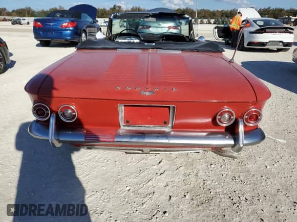 1964 Chevrolet Corvair with VIN 40967W287137, listed as a Copart auction lot 77769384 with 3,143 mi miles and Salvage title. Bid and sale history available at DreamBid. Image 6.