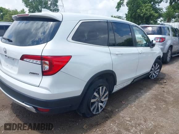 2021 Honda Pilot EX-L with VIN 5FNYF6H58MB075055, listed as a IAAI auction lot 42521760 with 59,336 mi miles and . Bid and sale history available at DreamBid. Image 4.