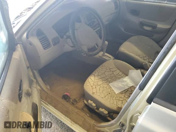 2002 Hyundai Accent GL z VIN KMHCG45C32U373009, wystawiony jako Copart lot #62753865 z przebiegiem Nie podano mil oraz Szkoda całkowita • Salvage title. Historia ofert i sprzedaży dostępna na DreamBid. Obrazek 8.