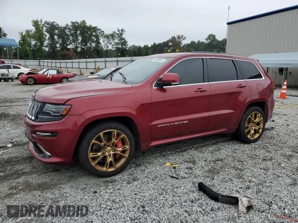 2014 Jeep Grand Cherokee SRT-8 with VIN 1C4RJFDJ2EC382063, listed as a Copart auction lot 69380995 with 174,198 mi miles and Clean title. Bid and sale history available at DreamBid. Image 1.