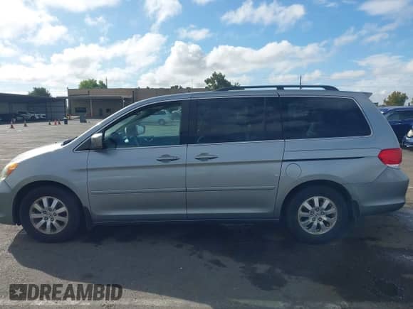 2008 Honda Odyssey EX-L with VIN 5FNRL38628B104477, listed as a IAAI auction lot 43363199 with 220,595 mi miles and . Bid and sale history available at DreamBid. Image 14.