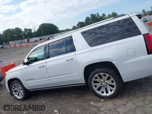 2019 Chevrolet Suburban Premier with VIN 1GNSCJKC9KR126778, listed as a IAAI auction lot 42675554 with 164,489 mi miles and . Bid and sale history available at DreamBid. Image 14.