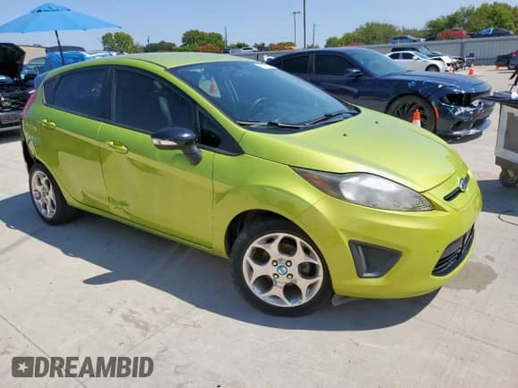 2012 Ford Fiesta SES with VIN 3FADP4FJ3CM111721, listed as a Copart auction lot 80182725 with 119,654 mi miles and Salvage title. Bid and sale history available at DreamBid. Image 4.