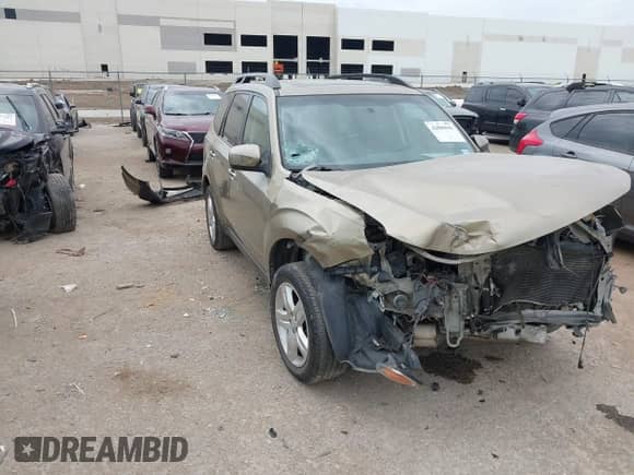 2009 Subaru Forester X z VIN JF2SH63609H723707, wystawiony jako IAAI lot #42880941 z przebiegiem 181 012 mil mil oraz . Historia ofert i sprzedaży dostępna na DreamBid. Obrazek 1.