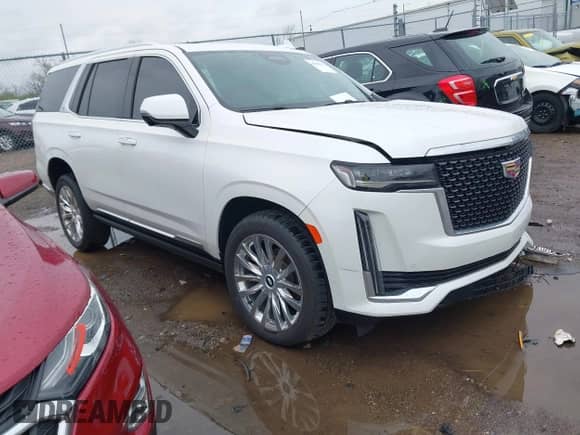 2021 Cadillac Escalade Premium Luxury z VIN 1GYS4CKL2MR216112, wystawiony jako IAAI lot #41956517 z przebiegiem 59 216 mil mil oraz . Historia ofert i sprzedaży dostępna na DreamBid. Obrazek 1.