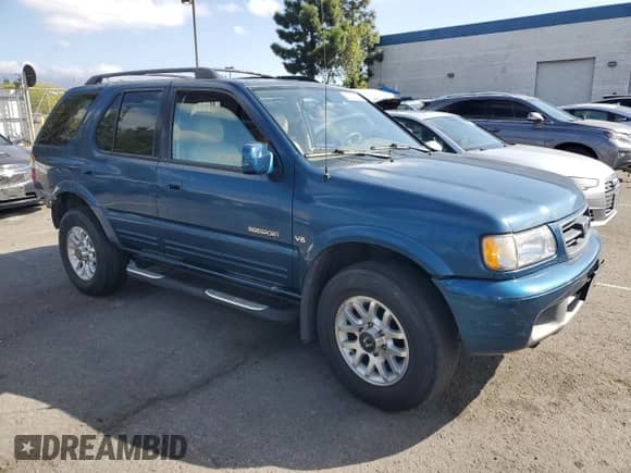 2000 Honda Passport LX with VIN 4S6CK58W6Y4400438, listed as a Copart auction lot 82210735 with 190,901 mi miles and Salvage title. Bid and sale history available at DreamBid. Image 4.