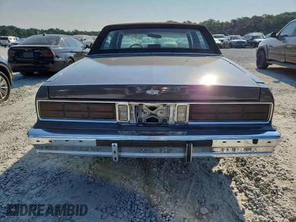 1985 Chevrolet Caprice с VIN 1G1BN69H6FY135833, выставлен на аукционе Copart как лот 80281155 с пробегом 2 381 миль миль и Списание • Salvage title. История ставок и продаж доступна на DreamBid. Изображение 6.