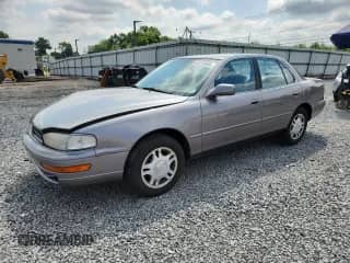 1993 Toyota Camry with VIN 4T1VK13E1PU075530, listed as a Copart auction lot 64218835 with 58,871 mi miles and Salvage title. Bid and sale history available at DreamBid. Image 1.