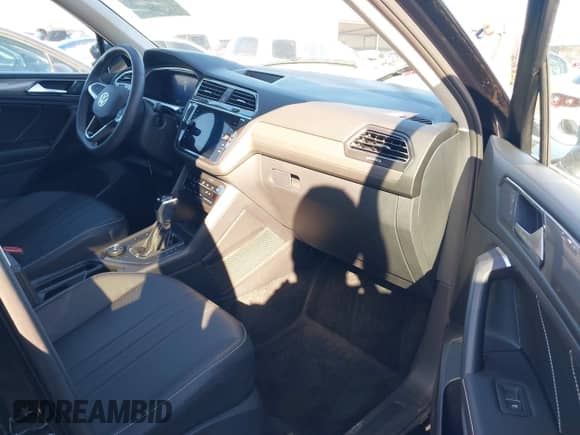 2023 Volkswagen Tiguan SE with VIN 3VVMB7AX7PM032629, listed as a IAAI auction lot 41441468 with 52,518 mi miles and . Bid and sale history available at DreamBid. Image 5.