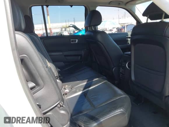 2014 Honda Pilot Touring z VIN 5FNYF4H95EB047979, wystawiony jako IAAI lot #43526927 z przebiegiem 158 501 mil mil oraz . Historia ofert i sprzedaży dostępna na DreamBid. Obrazek 8.