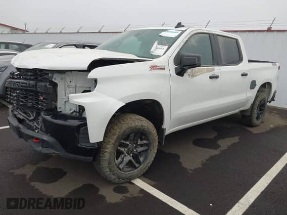 2022 Chevrolet Silverado 1500 Custom Trail Boss with VIN 3GCPYCEK3NG147175, listed as a IAAI auction lot 38760584 with 9,256 mi miles and . Bid and sale history available at DreamBid. Image 2.