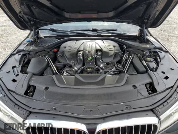 2016 BMW 7 Series 750i with VIN WBA7F0C53GGM20760, listed as a Copart auction lot 57230334 with 77,588 mi miles and Salvage title. Bid and sale history available at DreamBid. Image 11.
