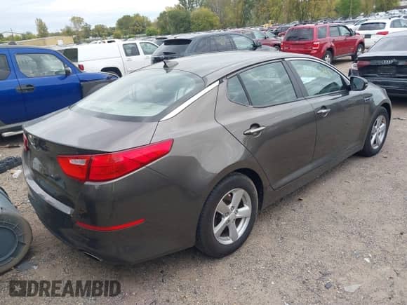 2015 Kia Optima LX with VIN 5XXGM4A79FG401947, listed as a IAAI auction lot 43375048 with 96,885 mi miles and . Bid and sale history available at DreamBid. Image 4.