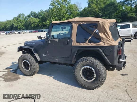 2003 Jeep Wrangler Rubicon с VIN 1J4FA69S23P310588, выставлен на аукционе Copart как лот 66919775 с пробегом 106 685 миль миль и Списание • Salvage title. История ставок и продаж доступна на DreamBid. Изображение 2.