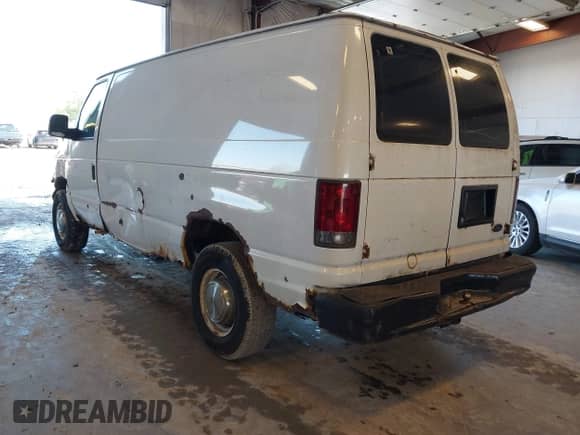 2003 Ford Econoline Cargo with VIN 1FTNE24W53HA22180, listed as a IAAI auction lot 42206484 with 306,921 mi miles and . Bid and sale history available at DreamBid. Image 3.