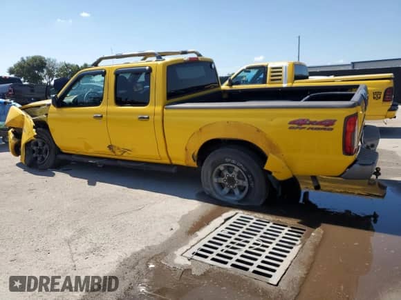 2004 Nissan Frontier XE with VIN 1N6ED29Y34C445431, listed as a Copart auction lot 66913525 with 155,387 mi miles and Salvage title. Bid and sale history available at DreamBid. Image 2.