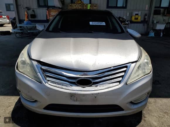 2012 Hyundai Azera с VIN KMHFH4JG8CA191831, выставлен на аукционе Copart как лот 63348985 с пробегом 189 389 миль миль и Списание • Salvage title. История ставок и продаж доступна на DreamBid. Изображение 5.