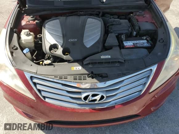 2013 Hyundai Azera z VIN KMHFG4JG1DA246270, wystawiony jako Copart lot #67242375 z przebiegiem 107 629 mil mil oraz Szkoda całkowita • Salvage title. Historia ofert i sprzedaży dostępna na DreamBid. Obrazek 11.