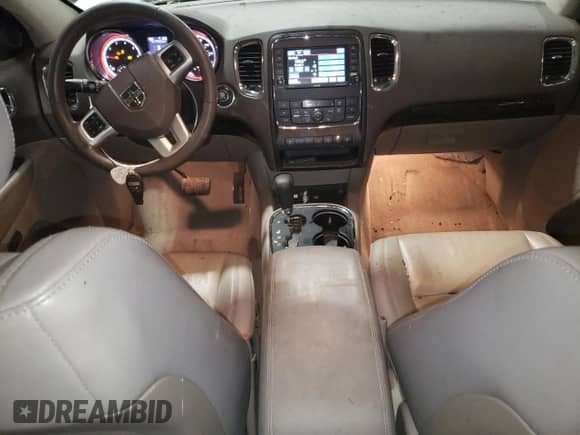 2013 Dodge Durango Crew with VIN 1C4RDJDG9DC554196, listed as a Copart auction lot 80313895 with 104,486 mi miles and Salvage title. Bid and sale history available at DreamBid. Image 8.