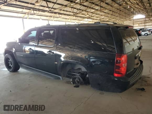 2013 Chevrolet Suburban LT with VIN 1GNSKJE74DR229904, listed as a Copart auction lot 65077365 with 167,582 mi miles and Salvage title. Bid and sale history available at DreamBid. Image 2.